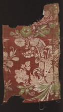 Fabric fragment. Fragments of silk patterned fabric with plant patterns; stripe decorated with