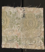 Fabric fragment. Cream silk damask fabric, embroidered and brocaded with colorful threads.