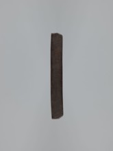 Double-sided gingerbread mould. Side A: female figure in a decorative bonnet and long patterned