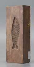 Double-sided gingerbread mould. Side A: figure of a lady in a decorative, pleated dress from the