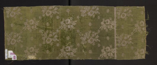 Fragment of a solid silk fabric, patterned with two joined branches bearing unfolded roses and