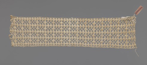 Fragment of crocheted lace — section of a belt, cream-colored, with motifs of semicircular shells