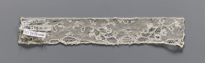 Lace fragment, bobbin lace, Valenciennes lace. Fragment of white bobbin lace with a continuous