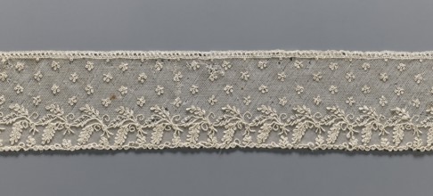 Fragment of lace, Alençon lace, decorated with small twigs in projections and a tendril with