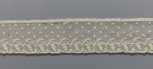 Fragment of lace, Alençon lace decorated with small twigs in projections and a tendril with