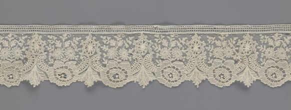 Lace fragment, lace with plant ornaments. Serrated on one side, with a pattern of flowers,
