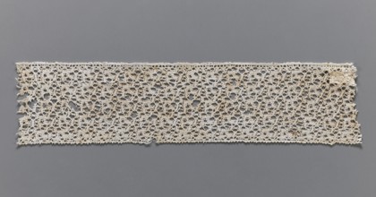 Lace fragment, bobbin lace, one edge finished with picots, 17th century, Flanders; width 6.5 cm,