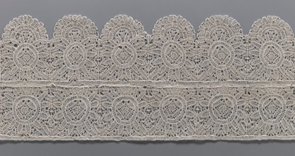 Lace fragment, bobbin lace, two pieces sewn together across their width: one with straight edges,
