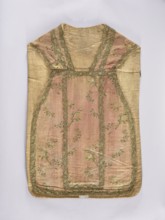 Chasuble, liturgical vestment;, noted. A large floral pattern and lace motif are set against a