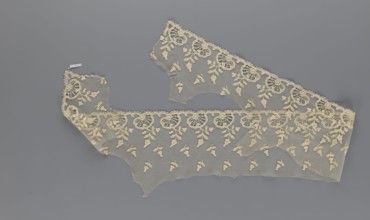 Fragment of lace, lace with plant ornaments, slightly serrated lower edge with shell motifs with