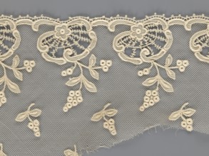 Fragment of lace, lace with plant ornaments, slightly serrated lower edge with shell motifs and