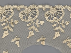 Fragment of lace, lace with plant ornaments, slightly serrated lower edge, featuring shell motifs