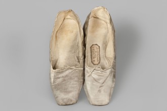 Flat women's slippers of white satin, top edge finished with ribbon. Flat-cut toes, symmetrical