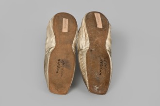 Flat women's slippers of white satin, top edge finished with ribbon. Flat-cut toes, symmetrical