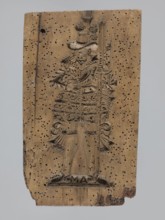 A single-sided gingerbread mold of rectangular shape with the image of a male figure in a richly