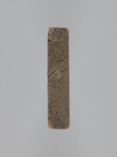 A single-sided gingerbread mold of rectangular shape with the image of a male figure in a richly