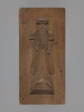 Double-sided gingerbread mould. Obverse: female figure in a long, patterned, richly decorated