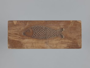 Double-sided gingerbread mould. Obverse: female figure in a long, patterned, richly decorated