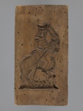 Double-sided gingerbread mould with the image of a rider on both sides, gingerbread; subject: