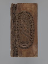 Double-sided gingerbread mould. Obverse: Madonna and Child with a crown, in a long patterned dress,