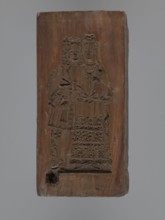 Double-sided gingerbread mould. Obverse: Madonna and Child with a crown, in a long patterned dress,