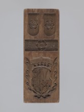 Double-sided gingerbread form. Obverse: heraldic shield; reverse: plant ornament. Double-sided