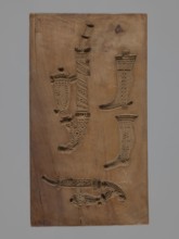 Double-sided gingerbread form. Obverse: four representations — two richly decorated oriental pipes