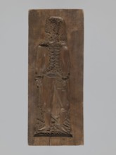 Double-sided gingerbread form. Obverse: male figure with a moustache in a hussar uniform, wearing a