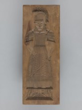 Double-sided gingerbread form. Obverse: female figure in a helmet; reverse: male figure in a helmet