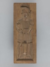Double-sided gingerbread form; obverse: female figure in a helmet; reverse: male figure in a helmet