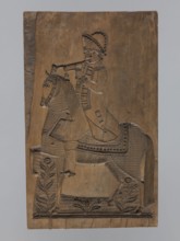 Double-sided gingerbread form. Obverse: image of a rider; reverse: four representations of human