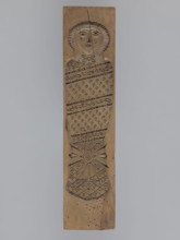 Double-sided gingerbread mold. Obverse: baby in swaddling clothes richly decorated with various