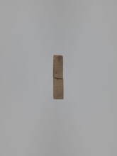 Double-sided gingerbread mold. Obverse: baby in swaddling clothes richly decorated with geometric