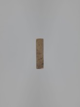 Double-sided gingerbread mold. Obverse: baby in swaddling clothes richly decorated with geometric