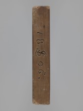 Double-sided gingerbread mould. Obverse: board with letters of the alphabet carved on it. Reverse: