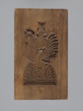 Double-sided gingerbread mold. Obverse: male figure on a rooster; reverse: bird. Double-sided