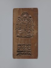Double-sided gingerbread mould. Rectangular mould; obverse: stylised elongated fish covered with