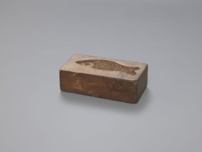 Double-sided gingerbread mould; obverse: stylised elongated fish covered with scales, shown in