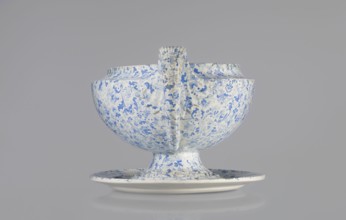Semi-ovoidal vase on a low pedestal base with sharply broken edges and tapering concave profile.