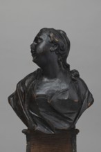 Bed finial in the form of a pediment with volutes on the sides and a corbel in the middle