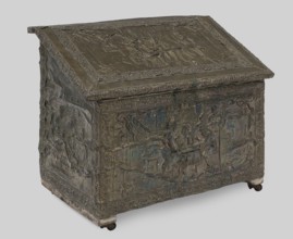 Box with straight walls and a diagonally sloping lid, covered with embossed brass sheet depicting