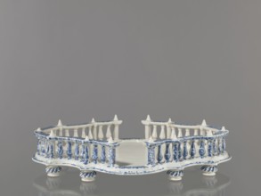 Base for a tabletop tray. Oval architectural tray serving as a base for a tabletop tray. Carved