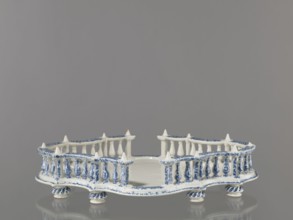 Base for a tabletop tray. Oval architectural tray serving as a base for a tabletop tray. Carved