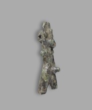 Mahes figurine, Mahes mythology. Uraeuses. Figurine of a walking ithyphallic male figure with a