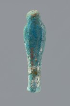 Ushabti, mummy-shaped funerary figurine wrapped in a shroud with its arms crossed on its chest,