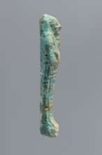 Ushabti, mummy-shaped funerary figurine wrapped in a shroud with its arms crossed on its chest,