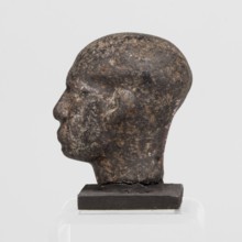 Head of a priest figurine, male, Egyptian sculpture; a man's head fragment of a statuette,