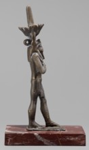Figurine of the god Nefertum; creator, Egyptian deity Nefertum; Egyptian religion and art; crown;