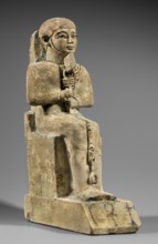 Figurine of the god Ptah. Figurine of the god Ptah sitting on a throne, on a base in the shape of