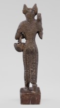 Figurine of the goddess Bastet. Figurine of a goddess with a cat's head, dressed in a